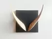“V” wall hanging object that “looks like an alphabet if you look closely” 