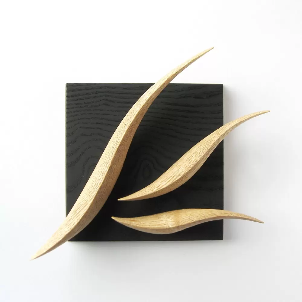 “K” wall hanging object” that looks like an alphabet if you look closely”   