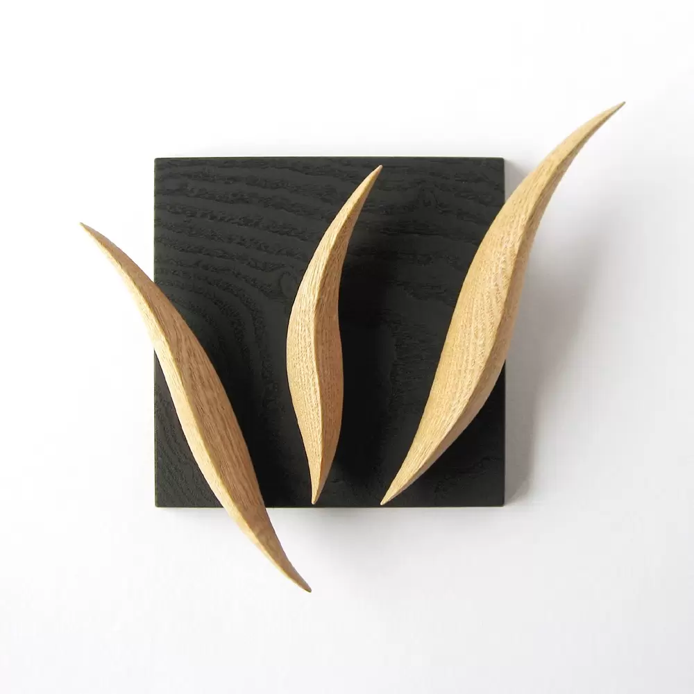 “W” wall hanging object” “looks like an alphabet when you look closely”